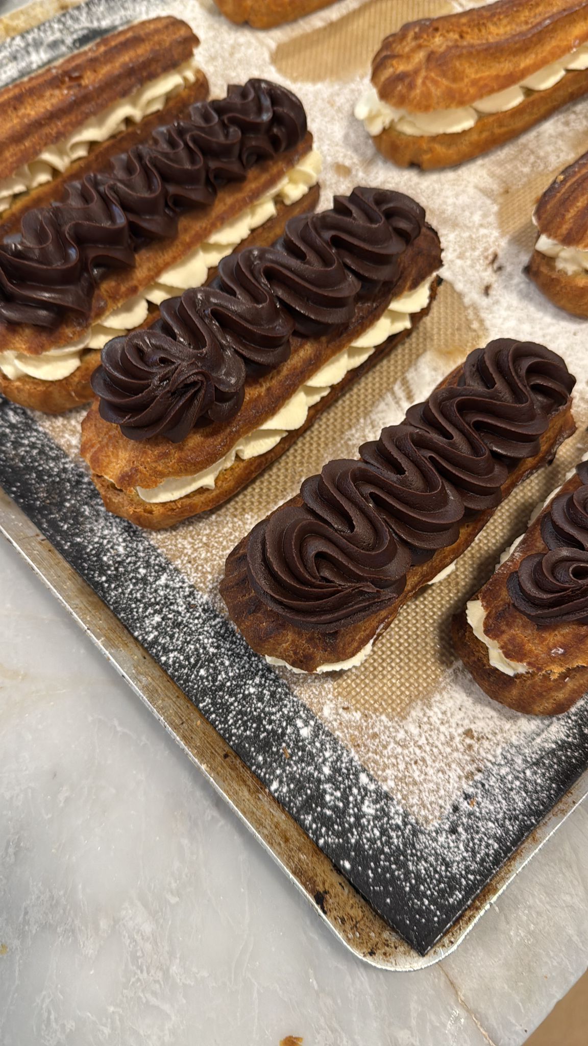 Chocolate eclairs filled with cream