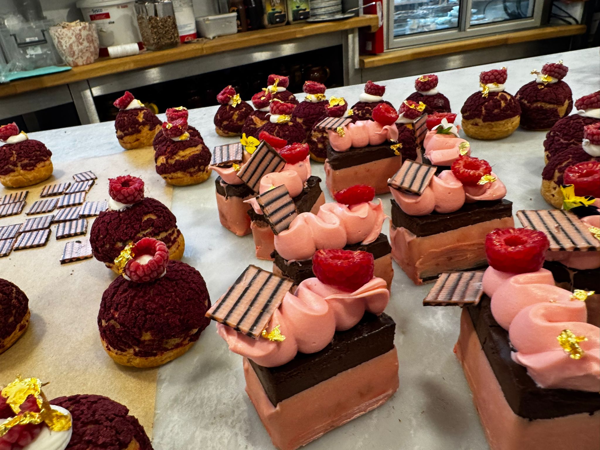 Raspberry choux buns and chocolate entremets