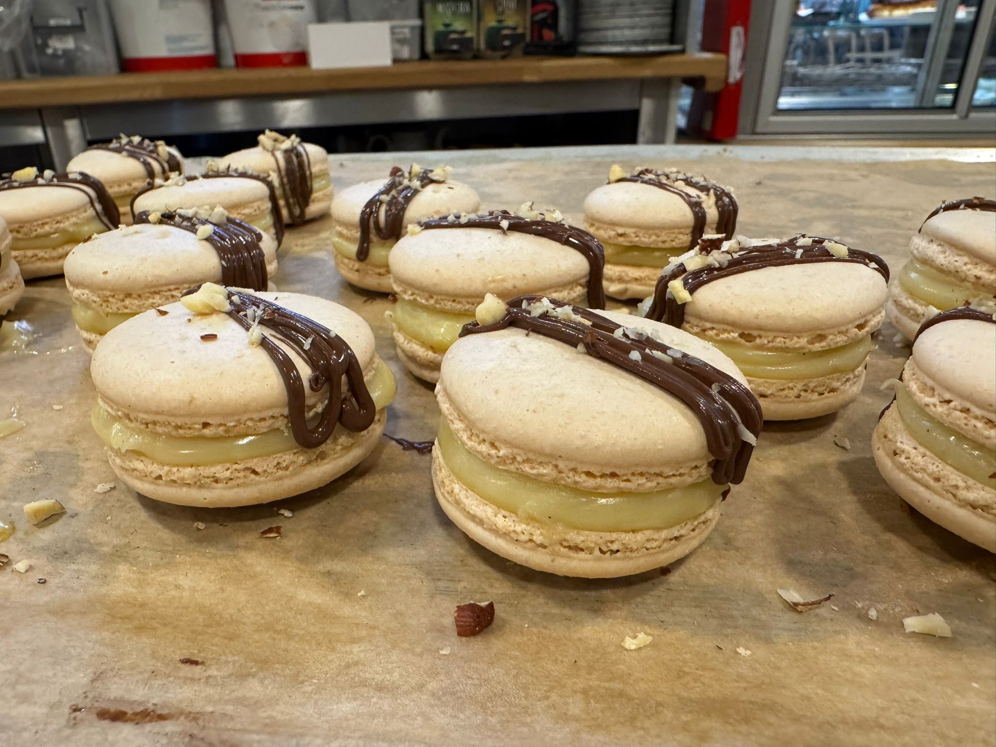 Vanilla macarons with chocolate drizzle
